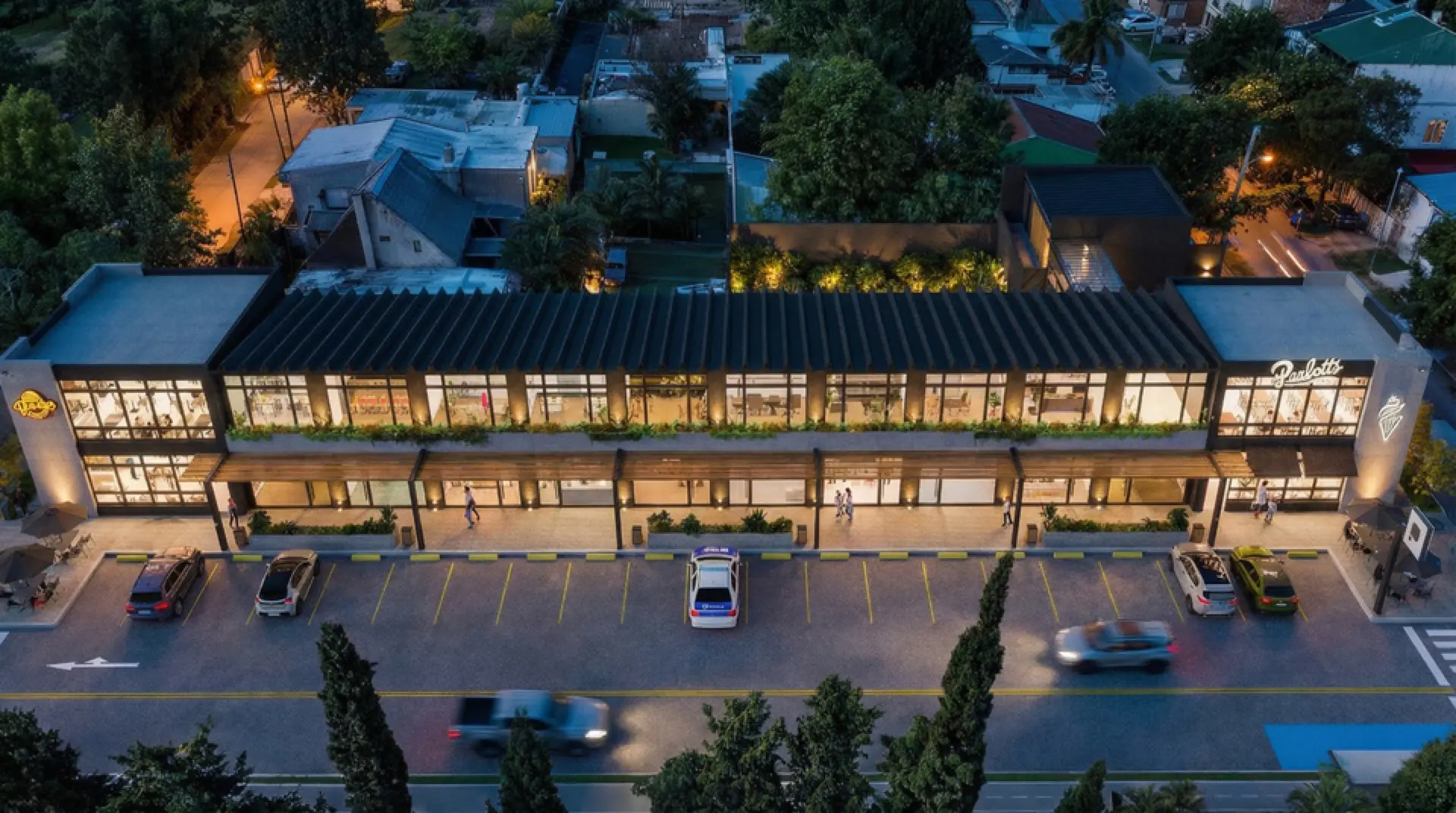 Render aéreo nocturno de Punto Patricias entre las casas del barrio